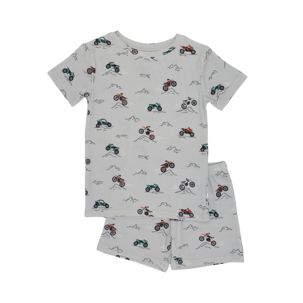 Children's shorts pajama set with vehicle pattern on a white background