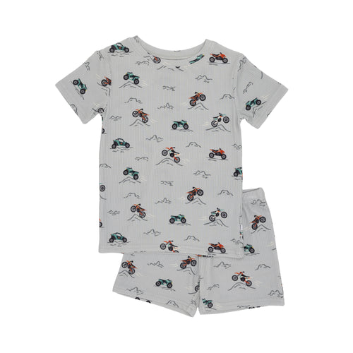 Children's shorts pajama set with vehicle pattern on a white background