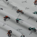 Close up shot of fabric with off-road vehicle pattern