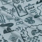 Fabric with a pattern of summer icons and symbols on a white background