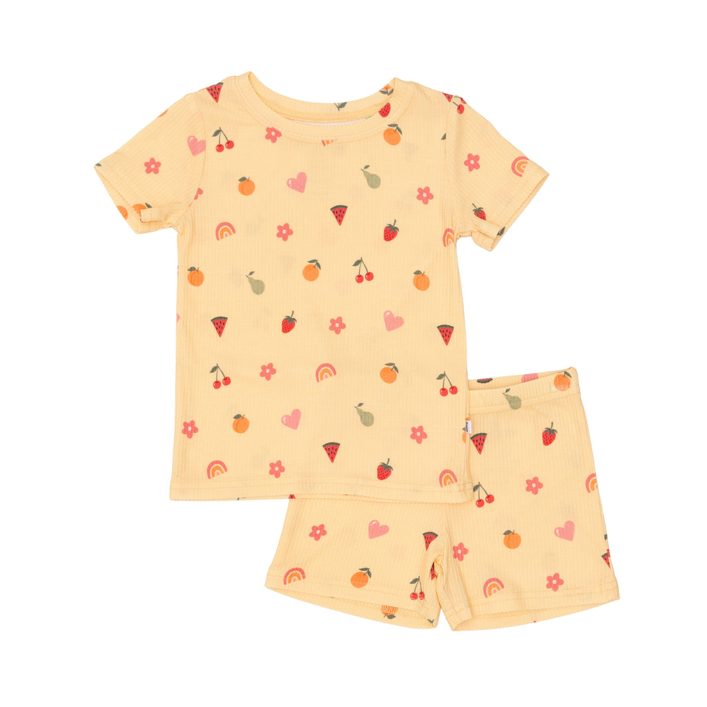Children's pajama set with fruit pattern on a white background