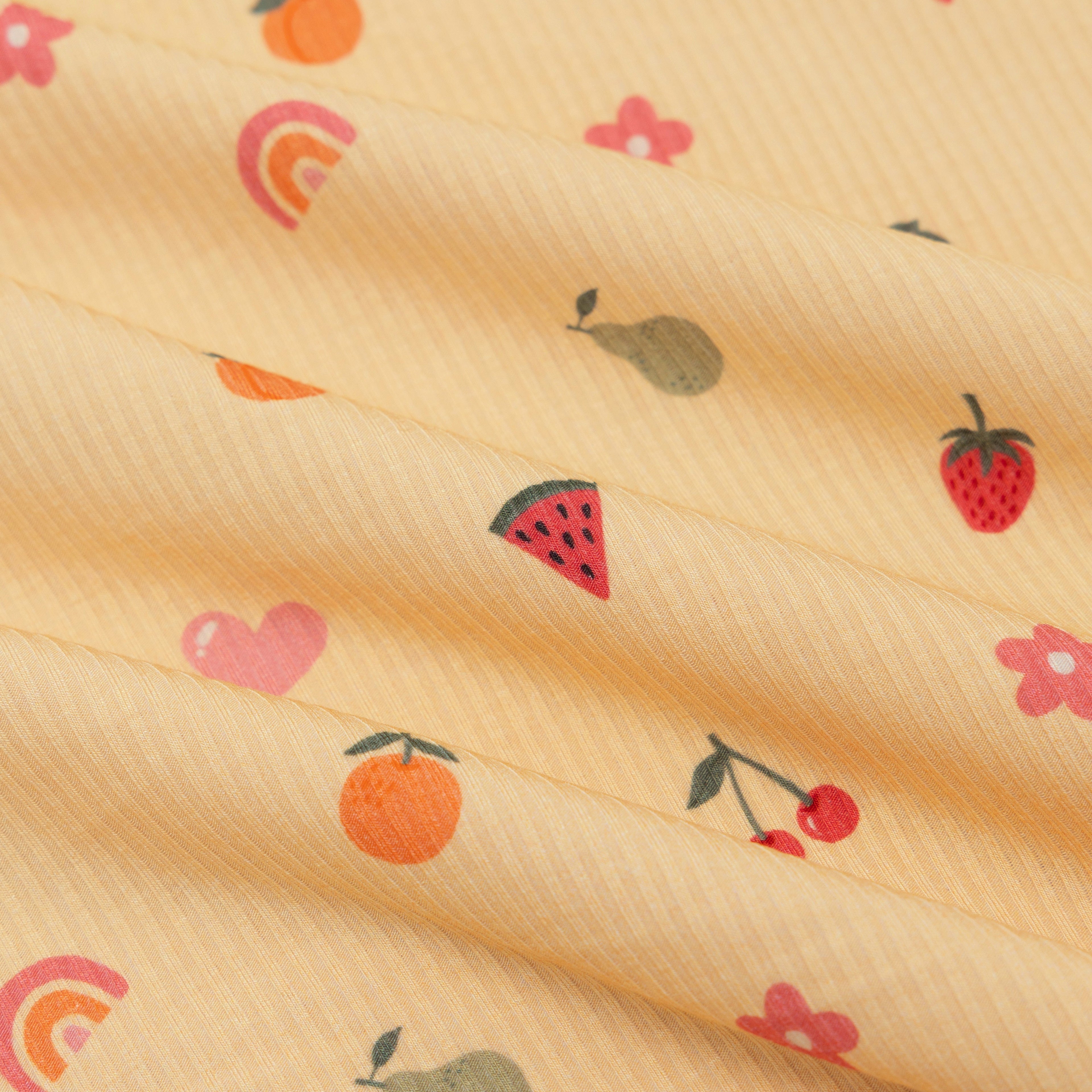 Fabric with colorful fruit and heart patterns on a yellow background