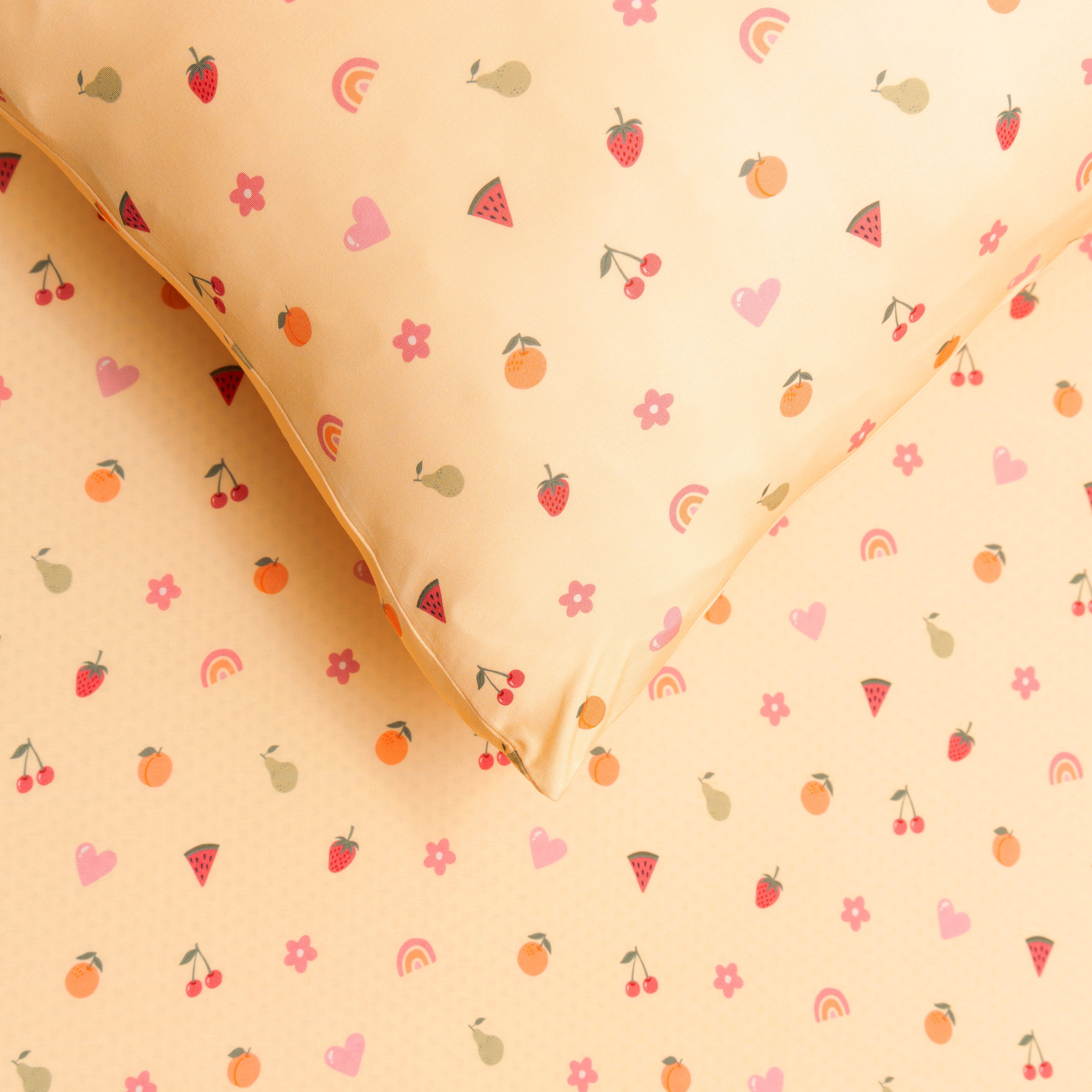Yellow fabric sheet with colorful fruit and rainbow pattern