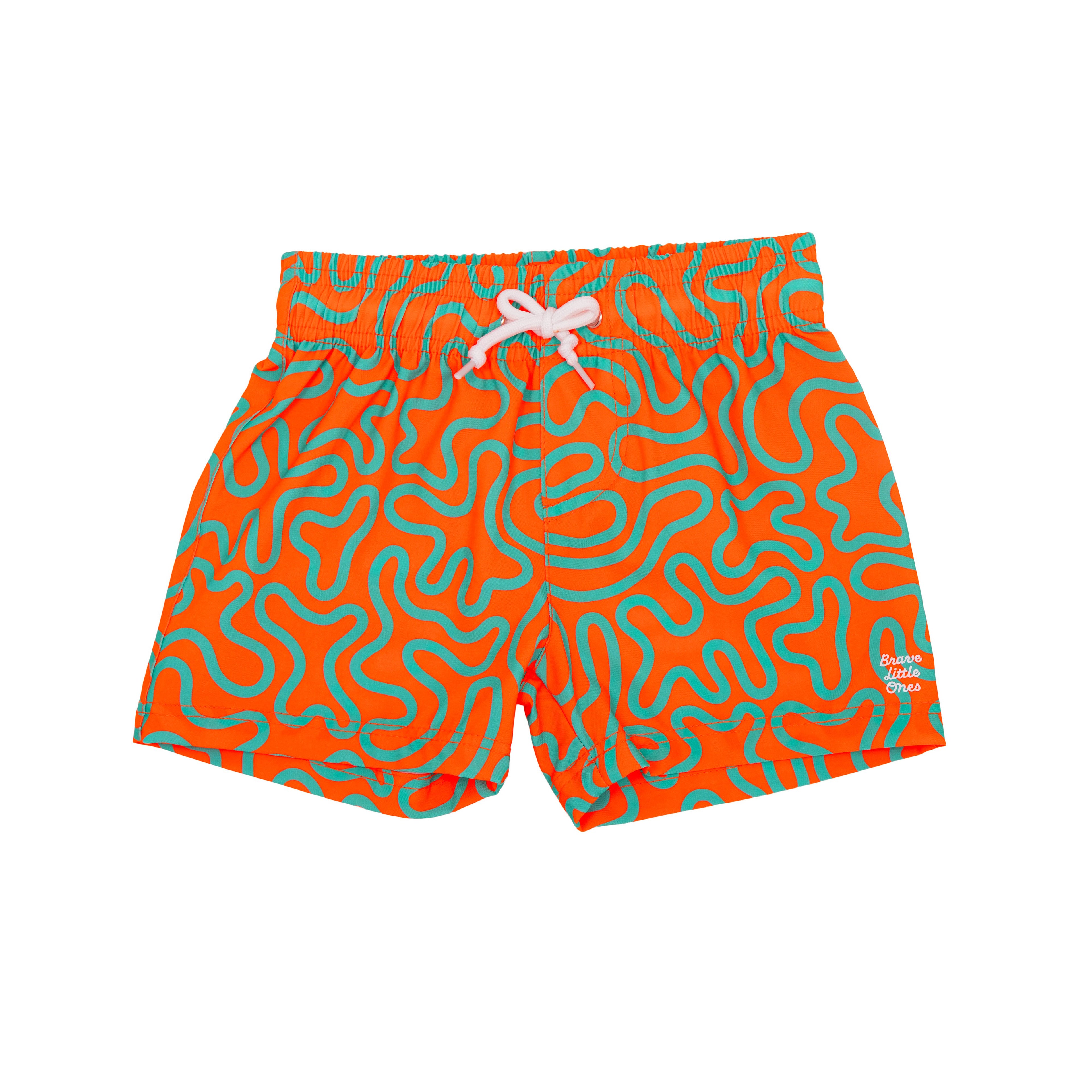 Orange and blue squiggly-patterned swim shorts on a white background