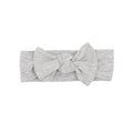 Gray heathered headband with a large bow on a white background