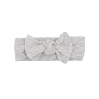 Gray heathered headband with a large bow on a white background