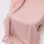Pink striped blanket draped over a chair on a white background