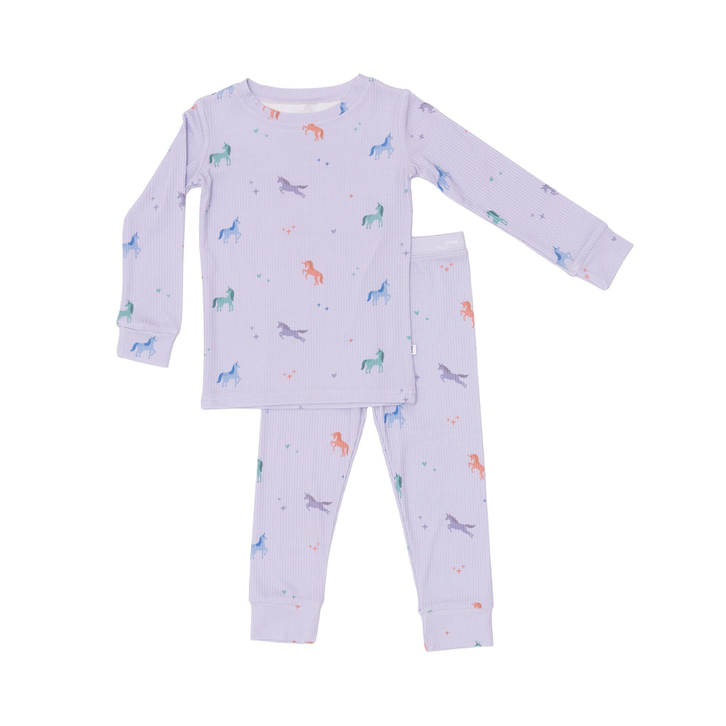 Children's pajama set with unicorn patterns on a white background