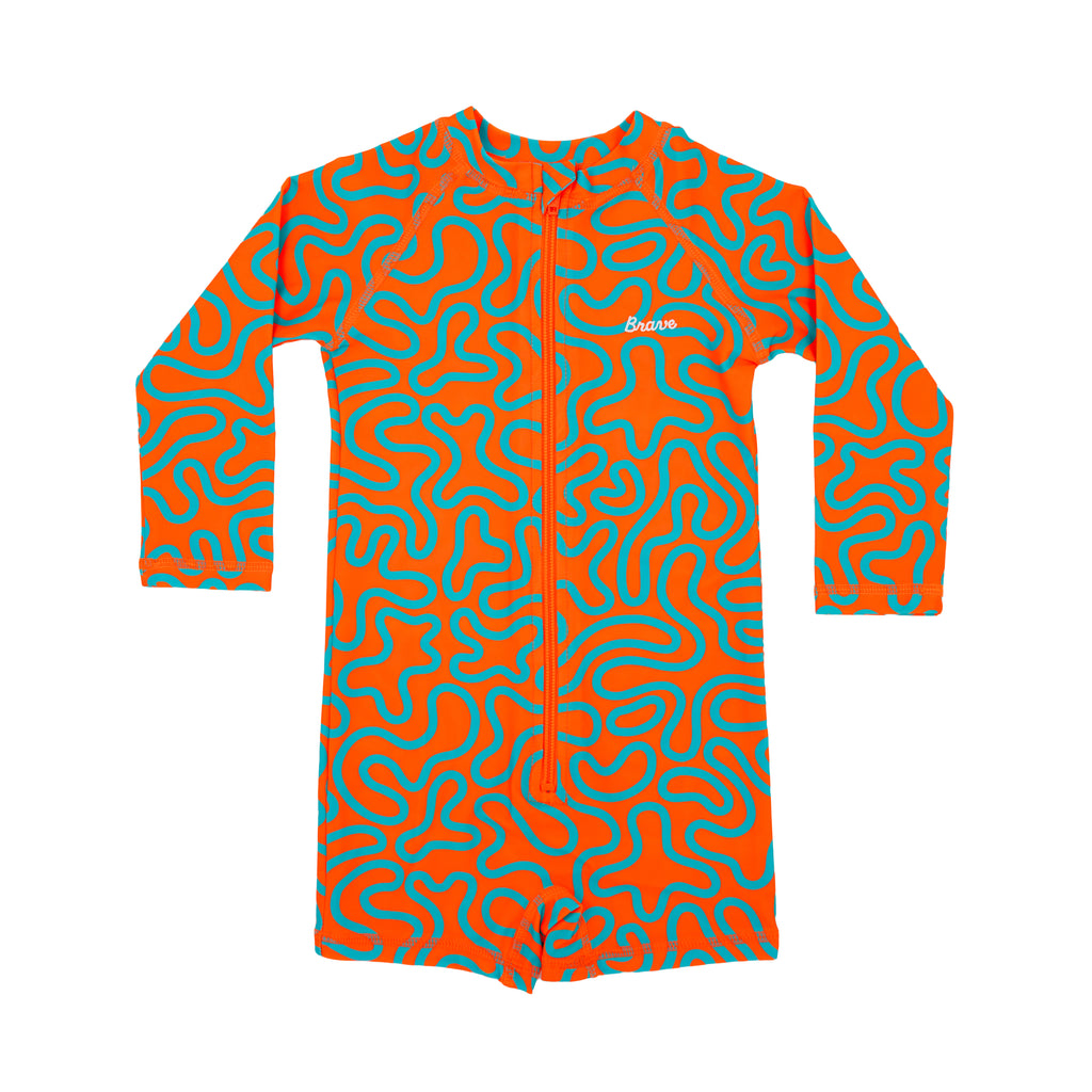 Orange and blue squiggly patterned boy swimsuit on a white background