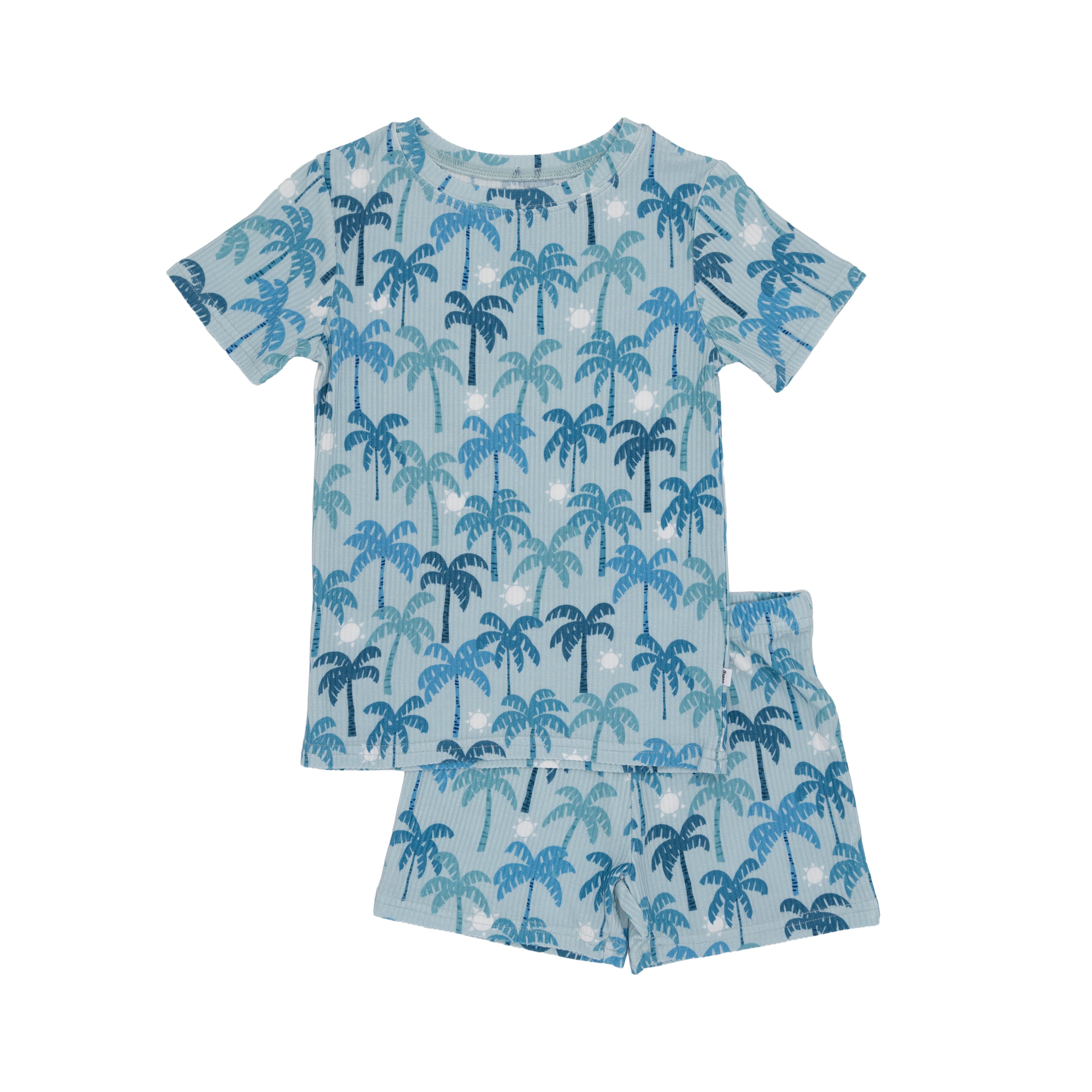Children's pajama set with blue palm tree pattern on a white background