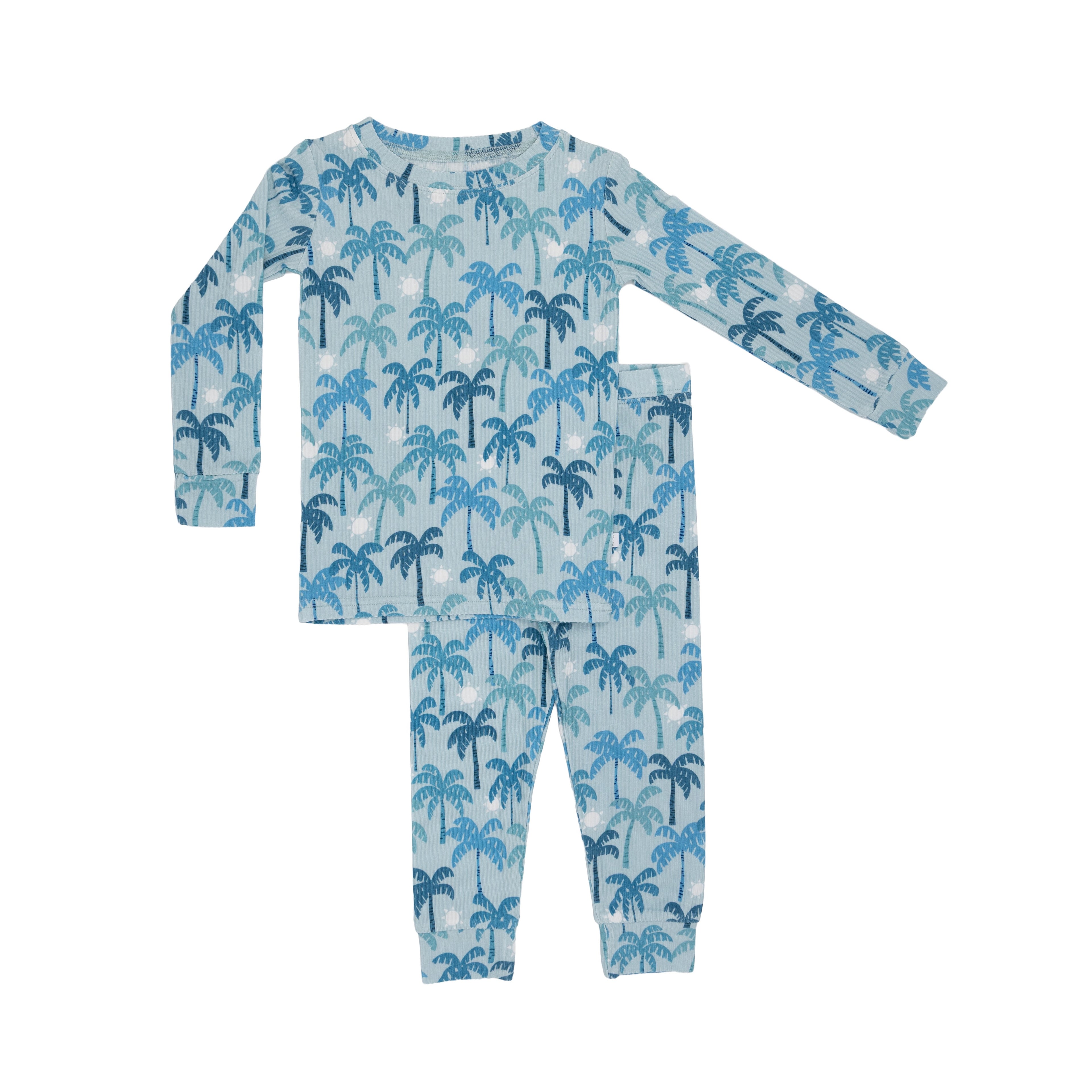 Children's pajama set with palm tree pattern on a white background