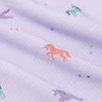 Fabric with colorful unicorn pattern on a light purple background