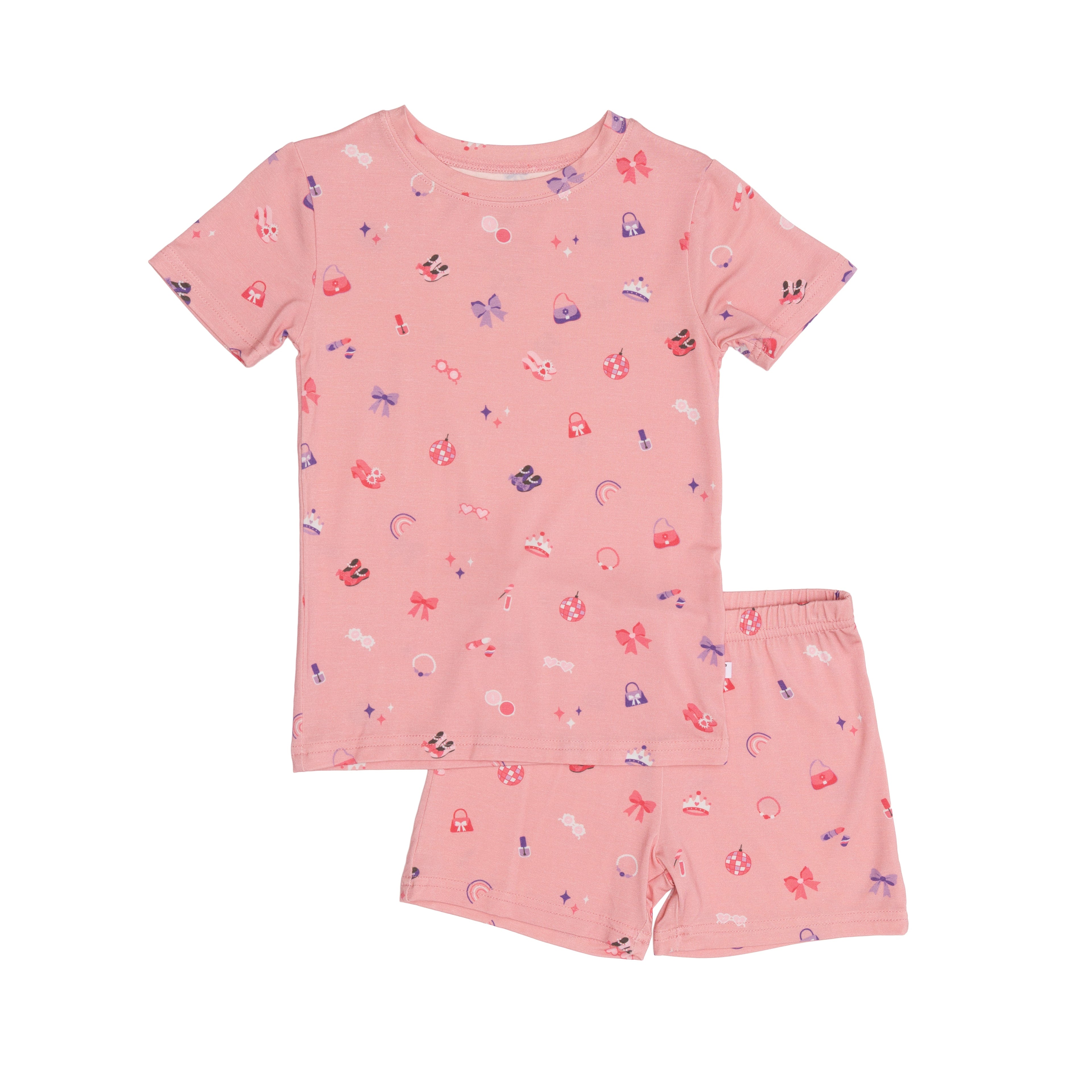 Pink children's pajama shorts set with girly patterns on a white background