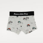 Children's underwear with dirt bike pattern and 'Brave Little Ones' label on a white background