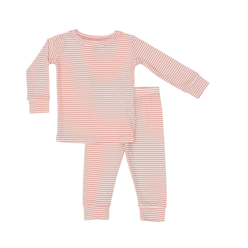 Pink and white striped pajama set on a white background