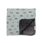 Children's blanket with bicyles & scooters pattern on a white background