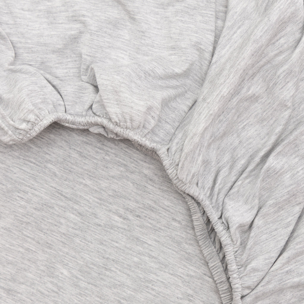 Close-up of gray heathered fabric with a white background