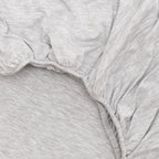 Close-up of gray heathered fabric with a white background
