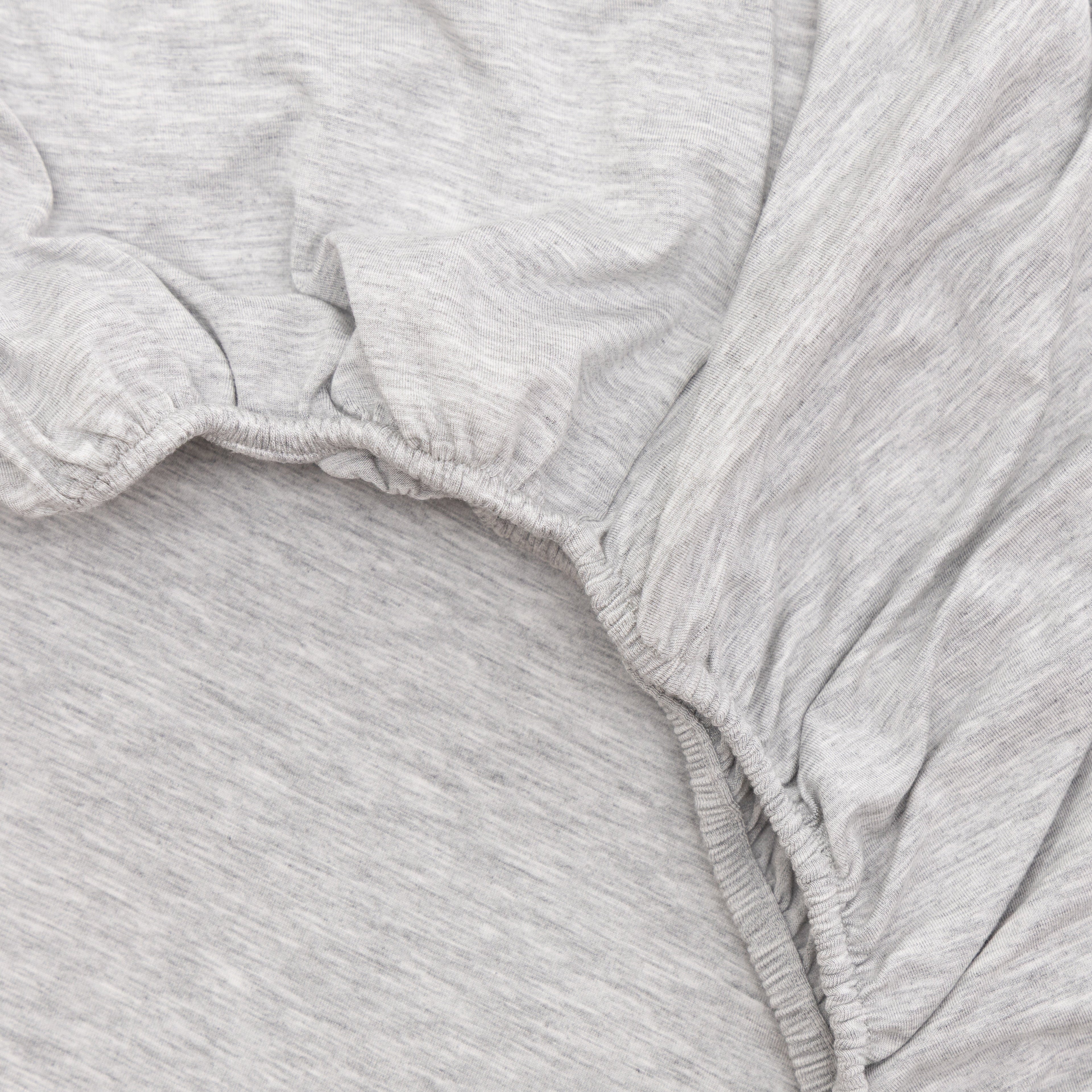 Close-up of gray heathered fabric with a white background