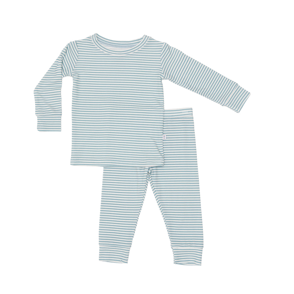 Blue and white striped pajama set with top and pants on a white background