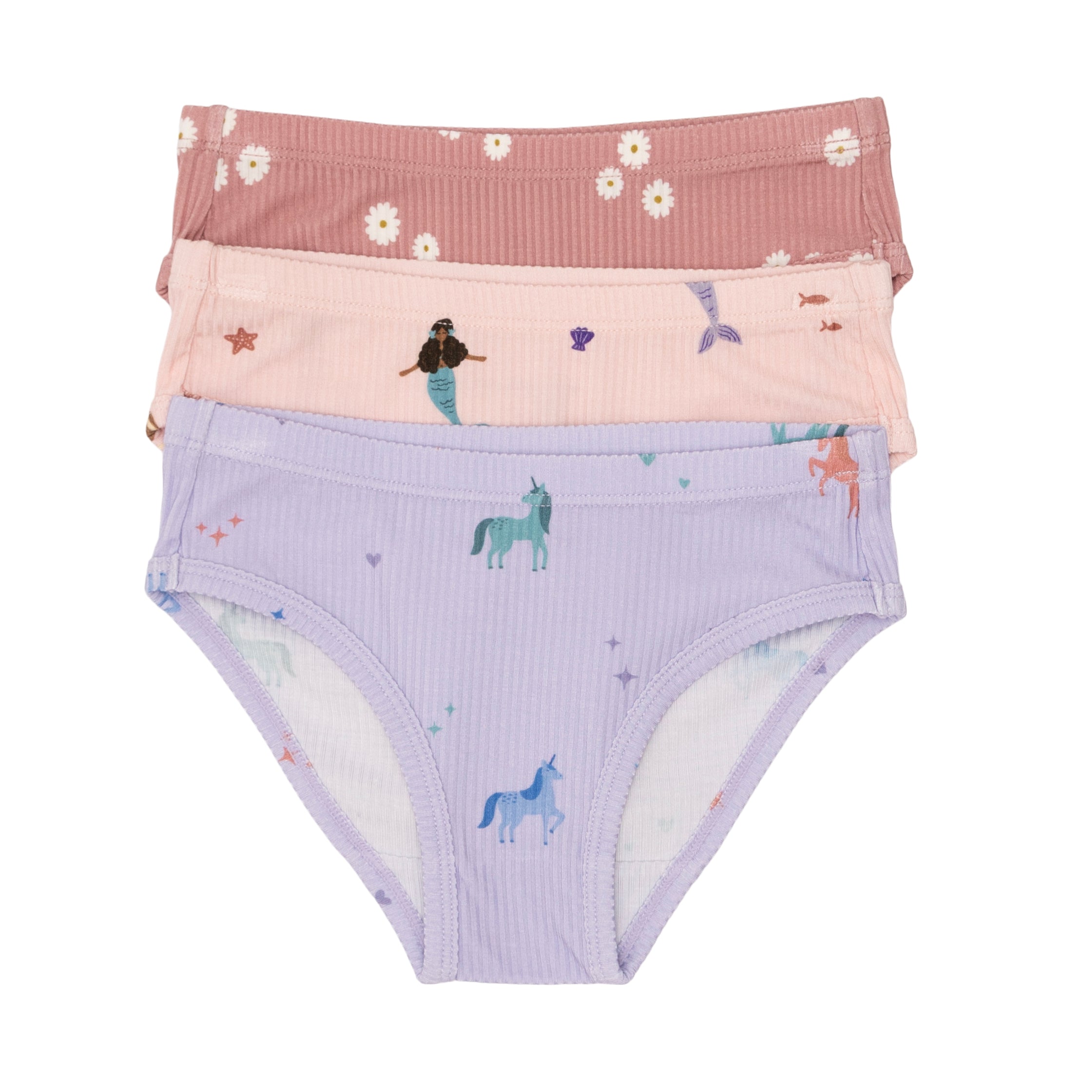 Set of three children's underwear with different girly patterns on a white background