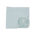Folded baby blanket with striped pattern on a white background