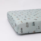 Fitted sheet with bicycle pattern on a light blue background