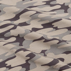 Camouflage pattern fabric in shades of brown, gray, and black.