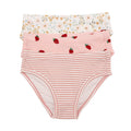Set of three children's underwear with floral, strawberry, and striped patterns on a white background.