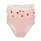 Set of three children's underwear with floral, strawberry, and striped patterns on a white background.