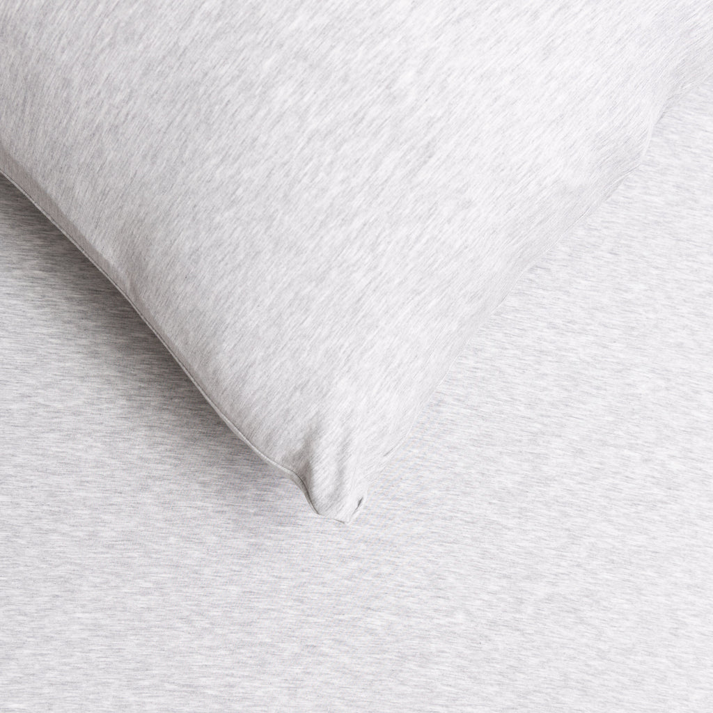 Close-up of a gray pillow on a matching gray fabric sheet