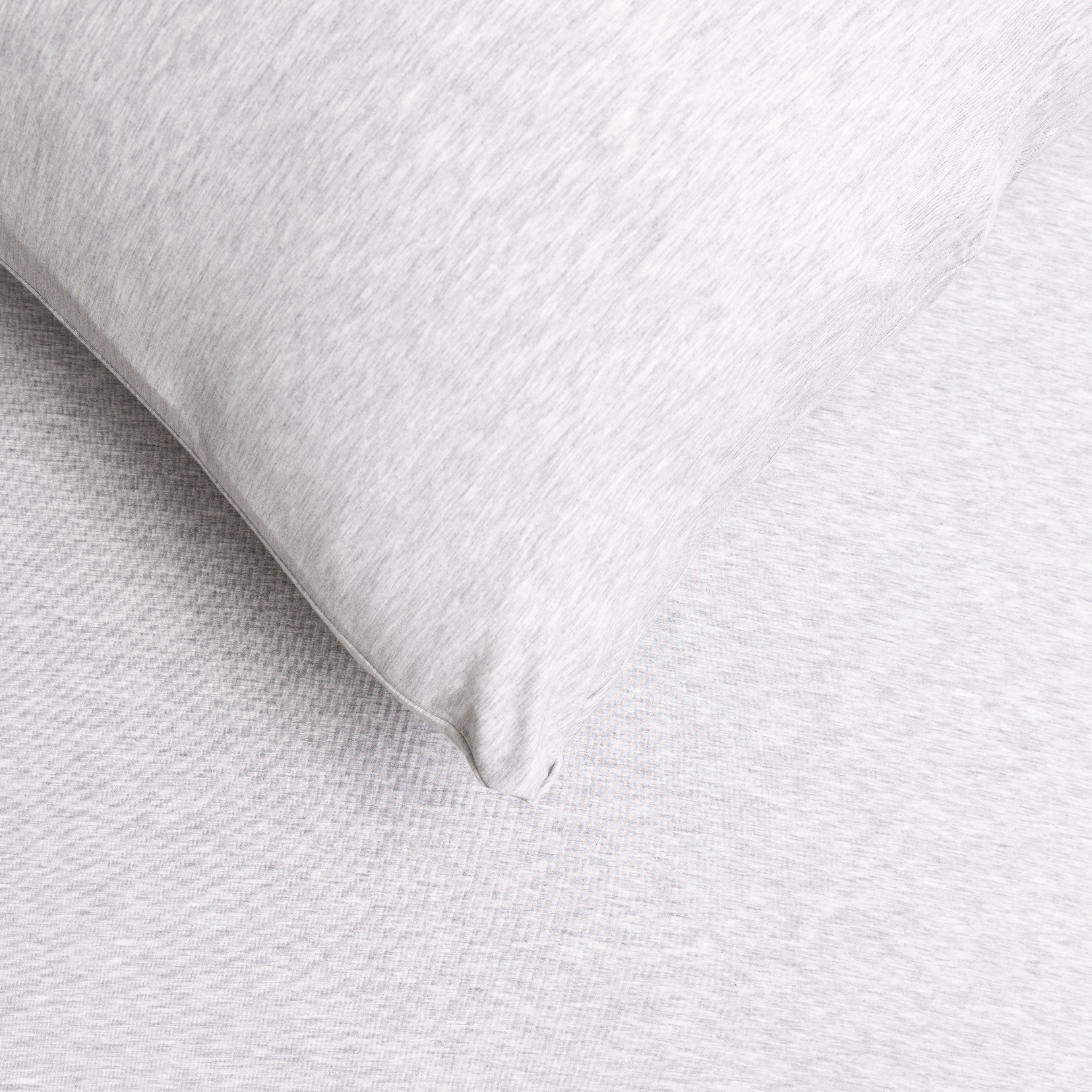 Close-up of a gray pillow on a matching gray fabric sheet