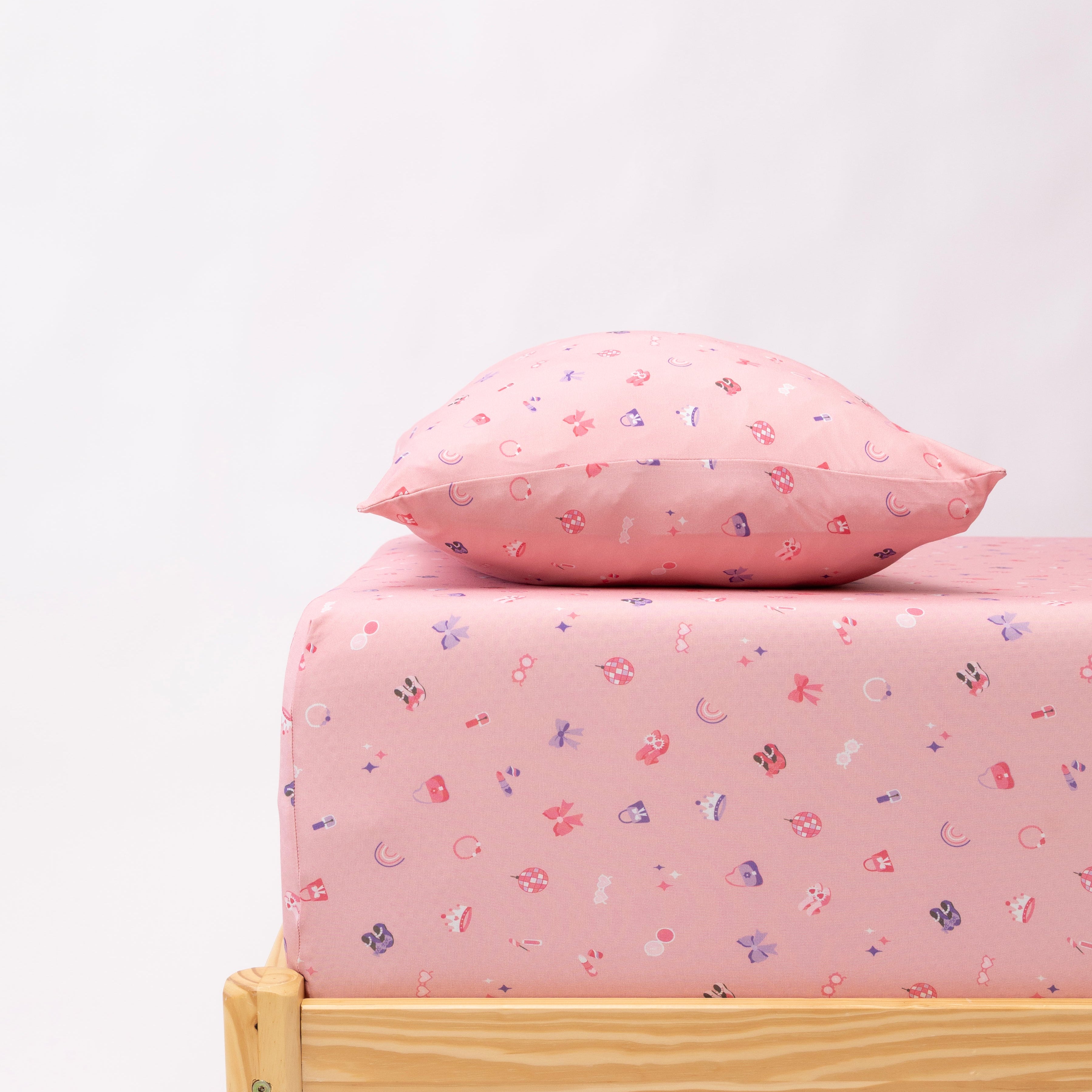 Bed with pink girly bedsheet and pillow on a white background