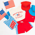 Collection of children's USA-themed clothing and accessories on a white background