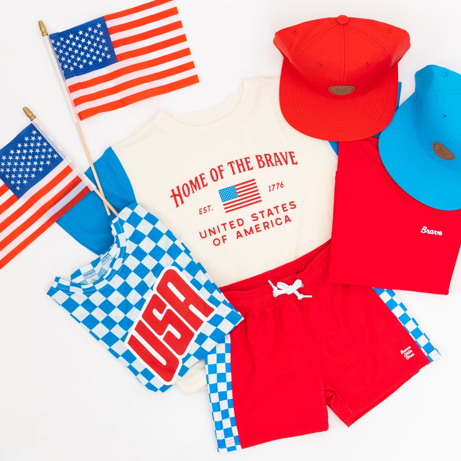 Collection of children's USA-themed clothing and accessories on a white background