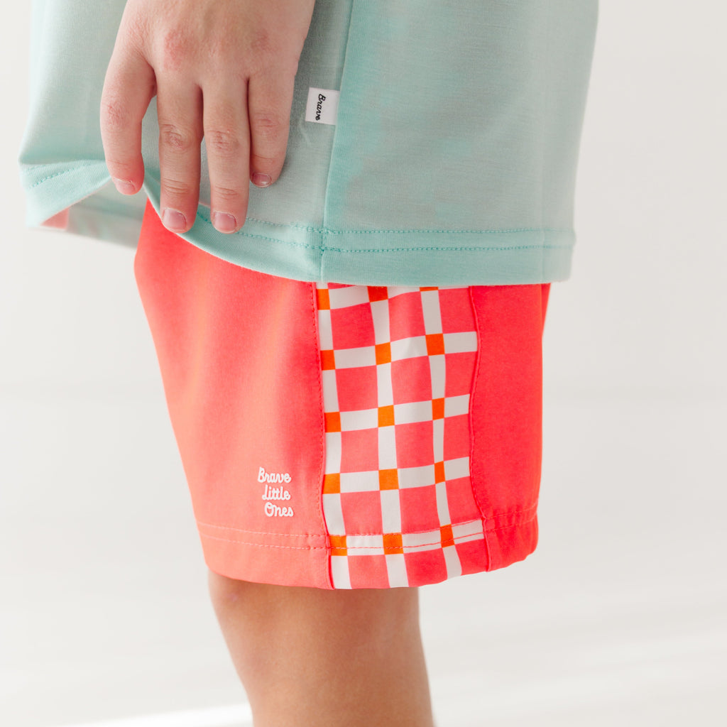 Neon Coral With Squares Swim Trunks