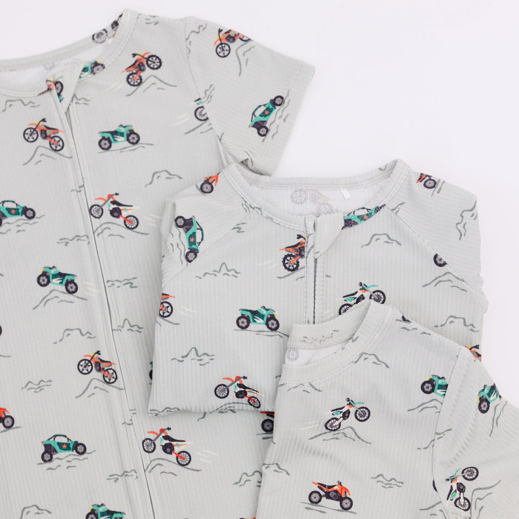 Set of pajamas with vehicle pattern in different styles on a white background