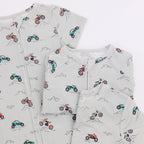 Set of pajamas with vehicle pattern in different styles on a white background