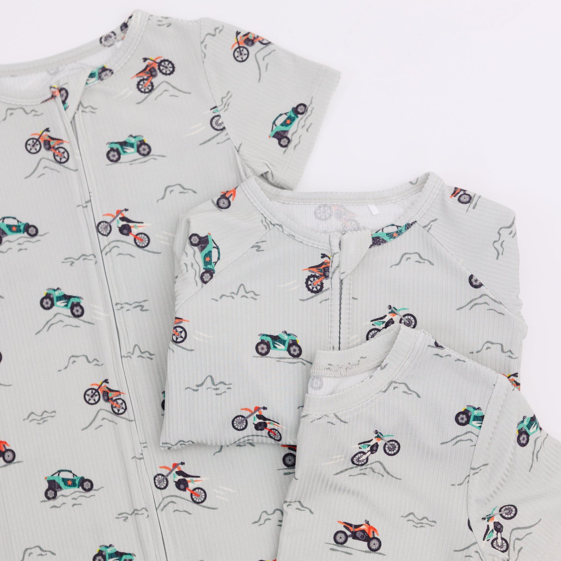 Set of pajamas with vehicle pattern in different styles on a white background