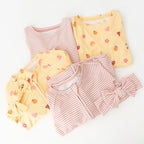 Children's different pajama sets with yellow and pink striped patterns on a white background