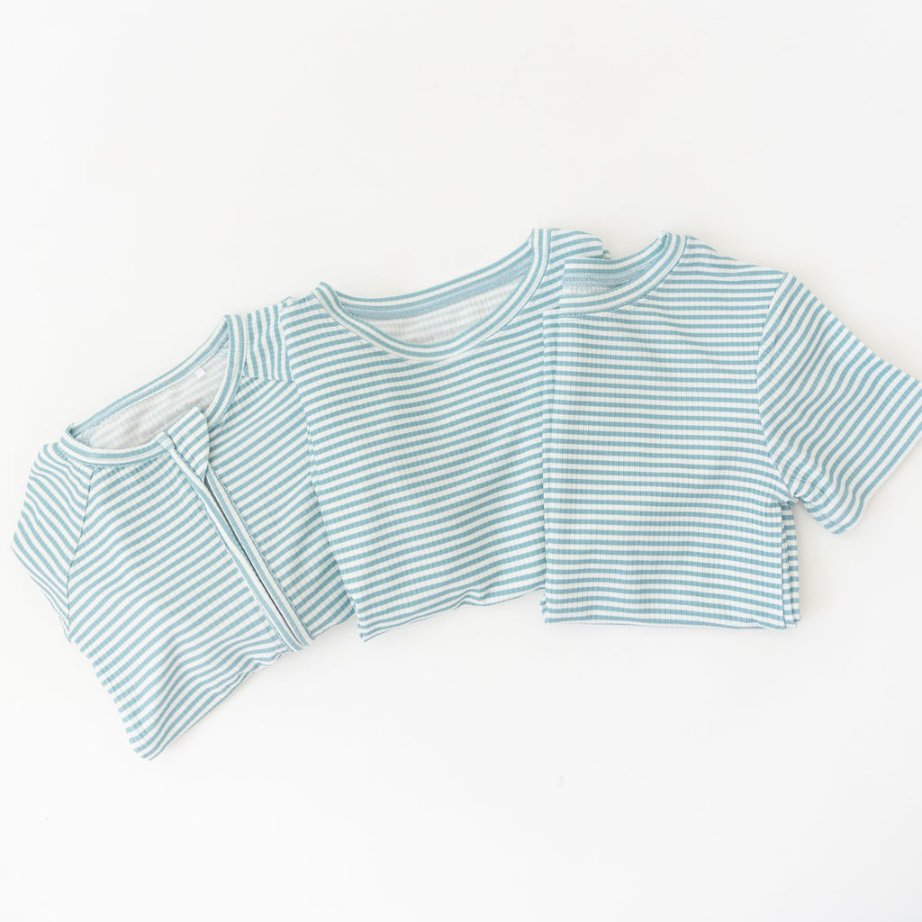 Blue and white striped pajama sets on a white background