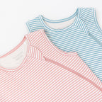 Two striped sleeping bags, one blue and white, one pink and white, on a white background