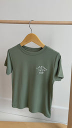 Green t-shirt with 'Fishing Club' text and logo hanging on a rack