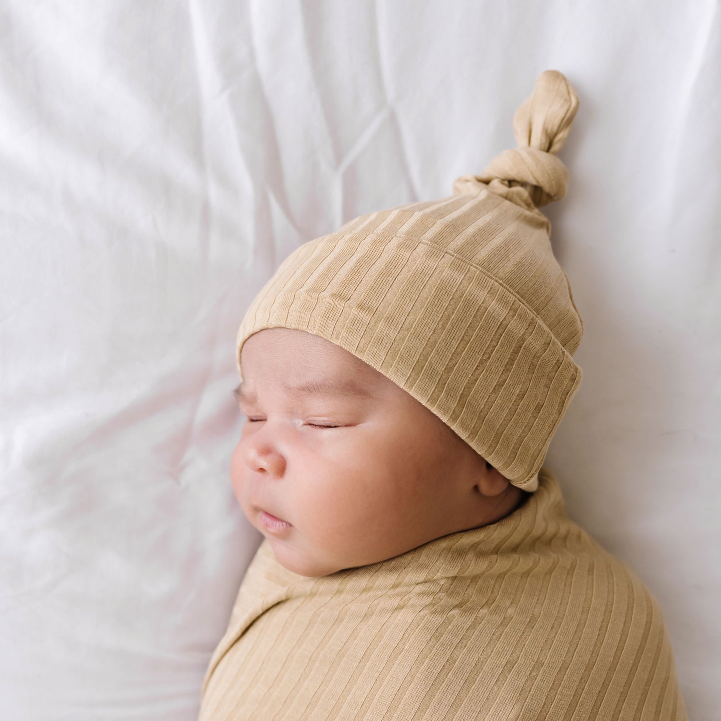 Tan Ribbed Infant Top Knot Beanie